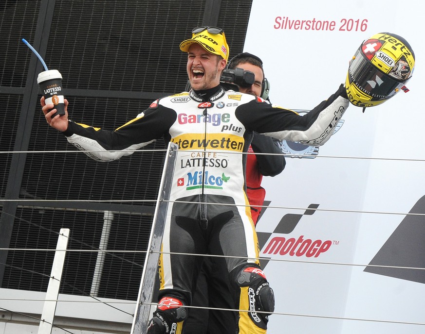 Switzerland&#039;s Thomas Luthi of Garage Plus Interwetten celebrates on the podium after winning the Moto2 race at the British Grand Prix at Silverstone, England, Sunday, Sept. 4, 2016. (AP Photo/Rui ...