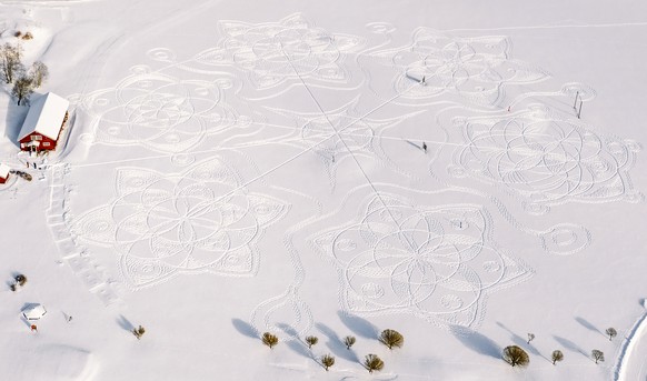 Part of a giant complex geometric pattern formed from thousands of footsteps in the snow near the capital Helsinki, in Espoo, Finland, Monday Feb. 8, 2021. The art work design measuring about 160 mete ...
