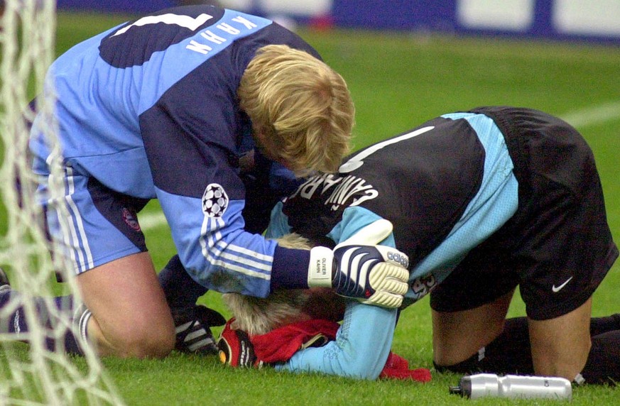 Bayern Munich goalie Oliver Kahn, left, consoles Valencia&#039;s goalie Santiago Canizares after Bayern Munich won the shooutout and captured the Champions League trophy at the San Siro stadium in Mil ...