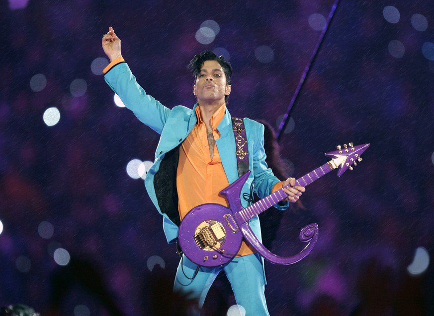 FILE - In this Feb. 4, 2007 file photo, Prince performs during the halftime show at the Super Bowl XLI football game at Dolphin Stadium in Miami. Fans remember Prince for his electrifying halftime per ...