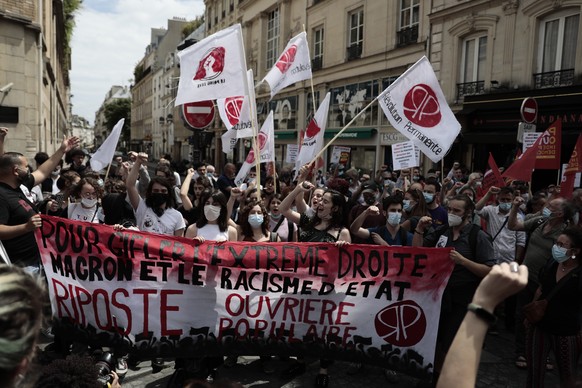 Demonstrators gather during a demonstration, Saturday, June 12, 2021 in Paris. Thousands of people rallied throughout France Saturday to protest against the far-right. (AP Photo/Lewis Joly)
