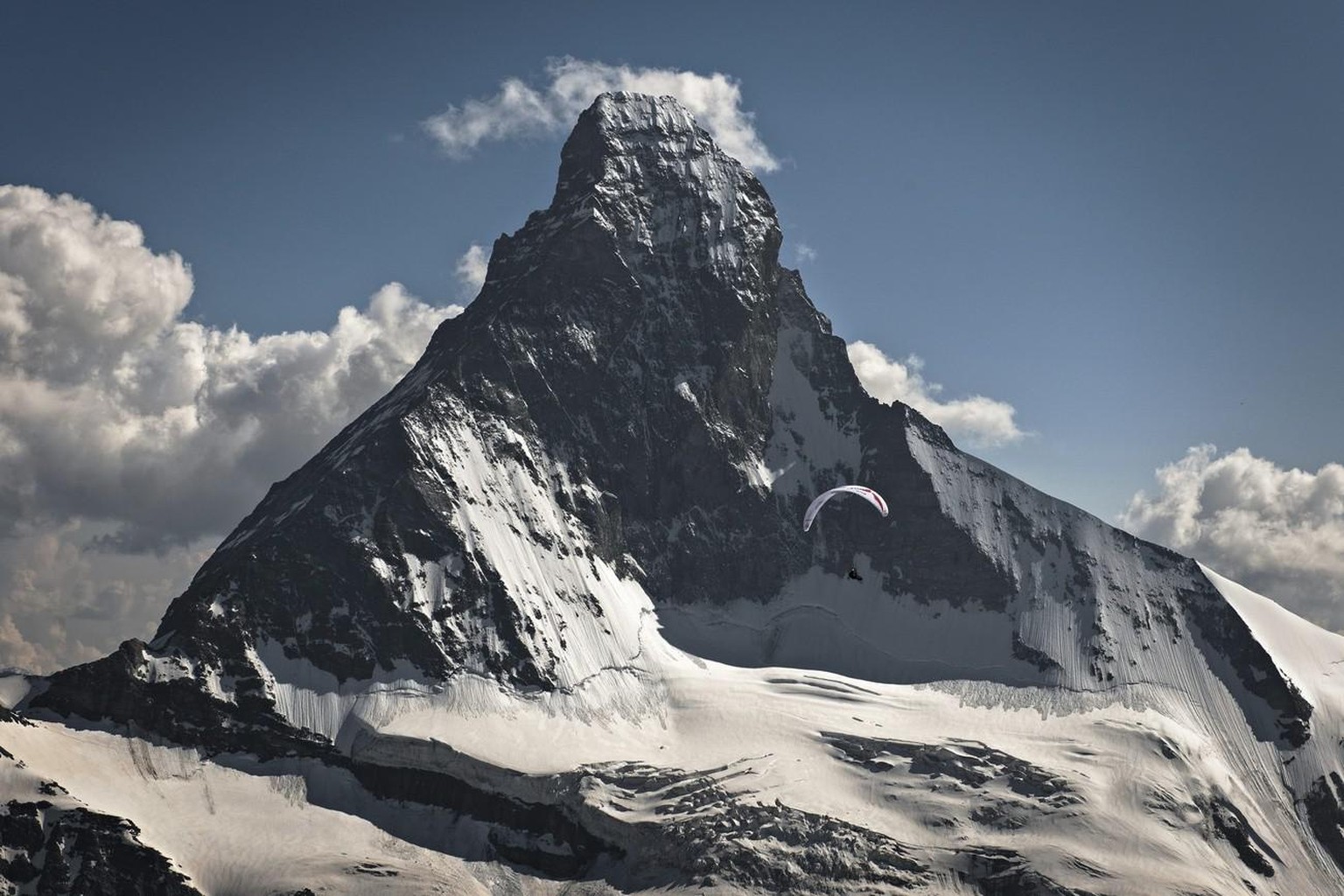 HANDOUT - Christian Maurer of Switzerland (SUI1) performs during the fifth day of the Red Bull X-Alps 2013 at the Matterhorn in Switzerland. At the sixth edition of the world&#039;s toughest adventure ...