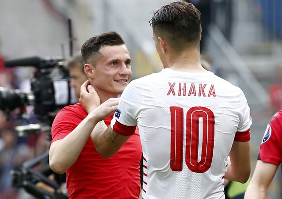 epa05357291 Switzerland&#039;s Granit Xhaka (R) and his brother Taulant Xhaka of Albania embrace after the UEFA EURO 2016 group A preliminary round match between Albania and Switzerland at Stade Bolla ...