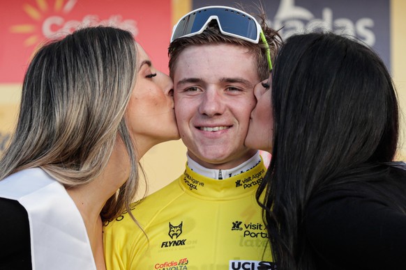 epa08231902 Belgian cyclist Remco Evenepoel of the Deceuninck-QuickStep team celebrates on the podium after winning the second stage of the 46th Algarve Tour over 183,9km between Sagres and Monchique, ...