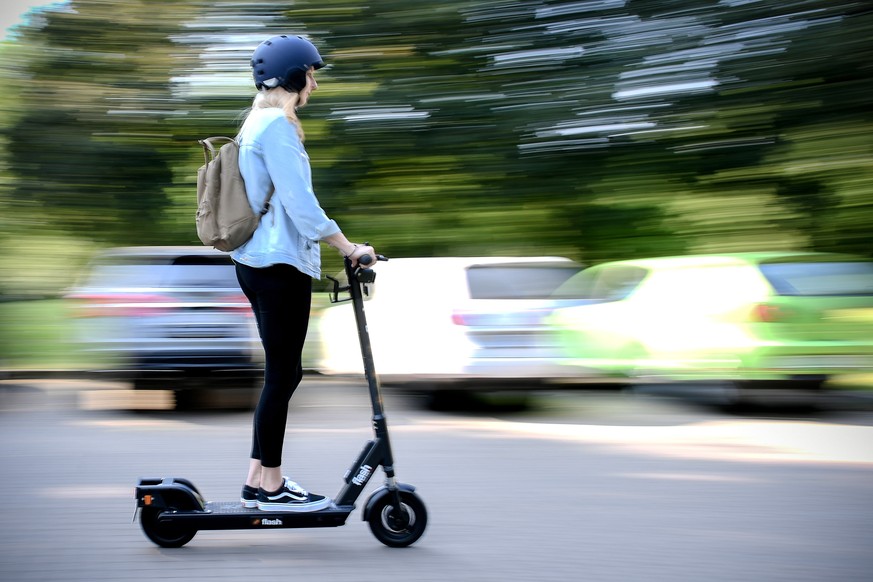 epa07627038 A woman rides an CIRC e-scooter (former FLASH) in Herne, Germany, 05 June 2019. Even before electric pedal-scooters are allowed nationwide on 15 June, a first provider will start a rental  ...
