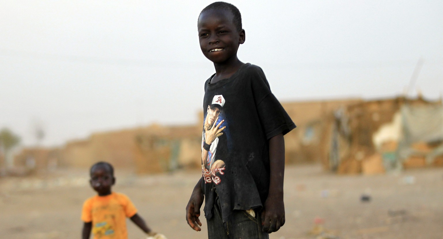 Children of South Sudanese stand at Mandela IDP (internally displaced persons) camp on the outskirts of Khartoum June 15, 2014. The Day of the African Child has been celebrated annually on June 16, si ...