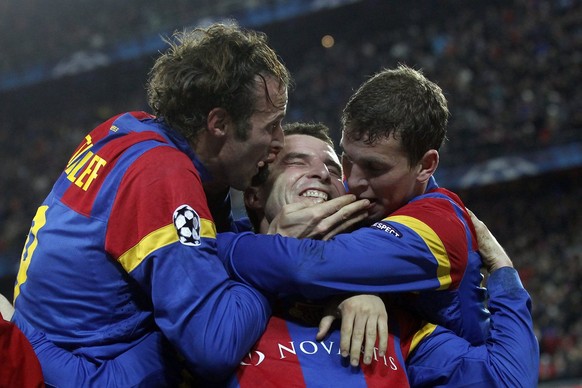 Basel&#039;s Alex Frei, center, celebrates after scoring the 2-0 with teammates Marco Streller, left, and Fabian Frei, right, during the UEFA Champions League Group C soccer match between Switzerland& ...