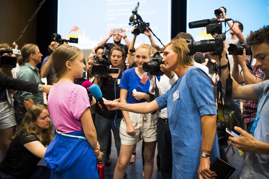 Swedish climate activist Greta Thunberg speaks to journalists during a press conference of the « Fridays For Future Summit » at the University of Lausanne, UNIL, in Lausanne, Switzerland, Monday, Augu ...