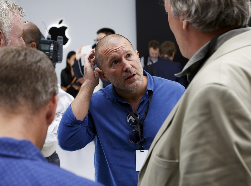 Apple Chief Design Officer Jonathan Ive and actor Stephen Fry (R) look over the Apple Watch Series 2 during a media event in San Francisco, California, U.S. September 7, 2016. REUTERS/Beck Diefenbach