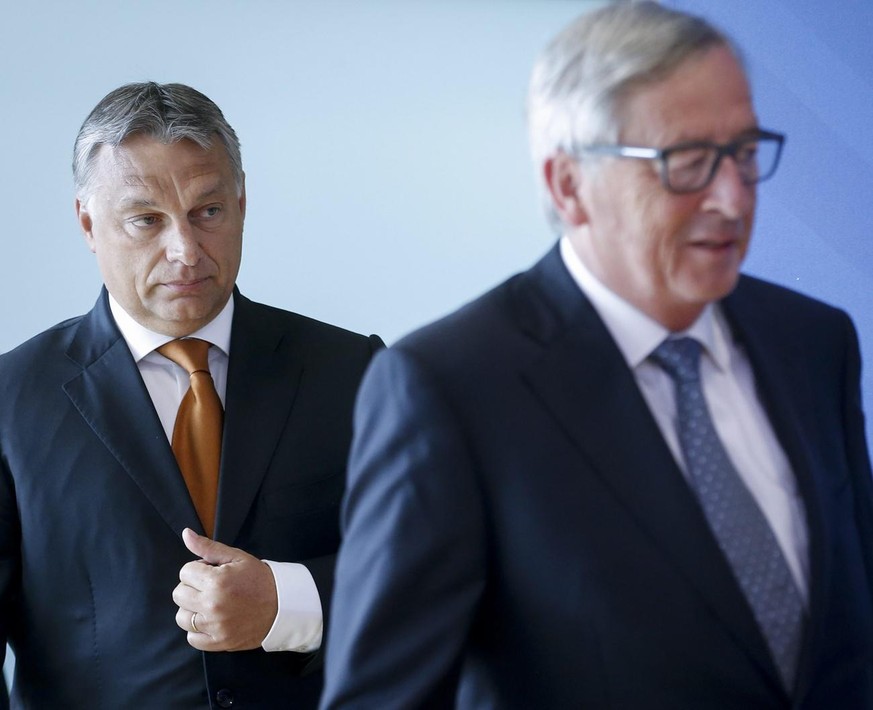 epa04910939 European Commission President Jean Claude Juncker (R) and Hungarian Prime Minister Viktor Orban prior to a meeting at the European Council in Brussels, Belgium, 03 September 2015. Orban is ...