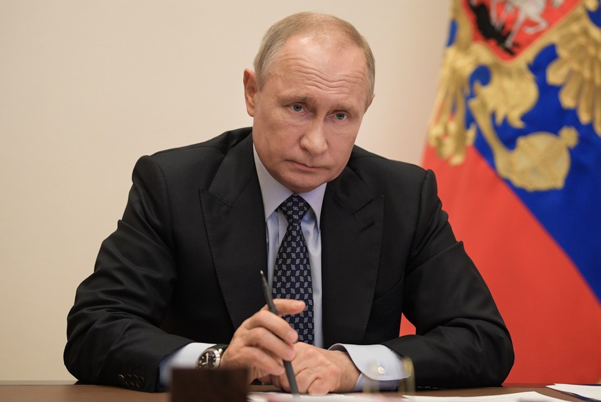 epa08391884 Russian President Vladimir Putin holds a video conference meeting on the development of the Russian fuel and energy industry at Novo-Ogaryovo residence, outside Moscow, Russia, 29 April 20 ...