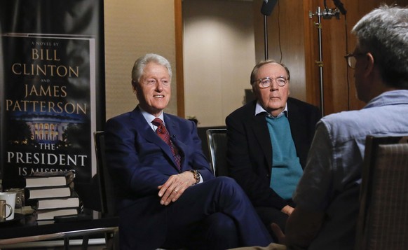 FILE - In this Monday, May 21, 2018, file photo, former President Bill Clinton, left, and author James Patterson speak during an interview about their novel, &quot;The President is Missing,&quot; in N ...