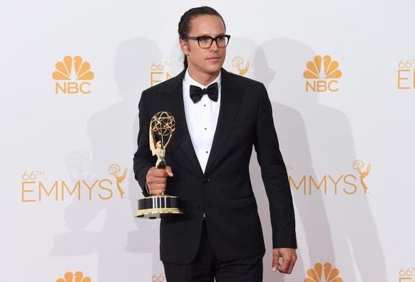 LOS ANGELES, CA - AUGUST 25: Director Cary Joji Fukunaga, winner of the Outstanding Directing for a Drama Series Award for True Detective (Episode: &quot;Who Goes There&quot;), poses in the press room ...