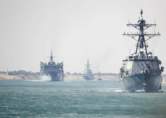 In this Thursday, May 9, 2019 photo released by the U.S. Navy, the Abraham Lincoln Carrier Strike Group transits the Suez Canal in Egypt. The aircraft carrier and its strike group are deploying to the ...