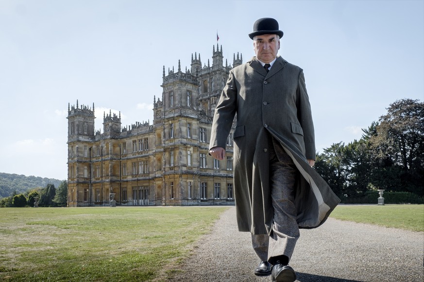 This image released by Focus features shows Jim Carter as Mr. Carson in a scene from &quot;Downton Abbey.&quot; The highly-anticipated film continuation of the â??Masterpieceâ? series that wowed audi ...