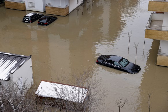 epa08931119 Cars are submerged in flood water in the town of Fushe Kosove, Kosovo, 11 January 2021. Due to heavy rain showers many areas were flooded across Kosovo. EPA/VALDRIN XHEMAJ