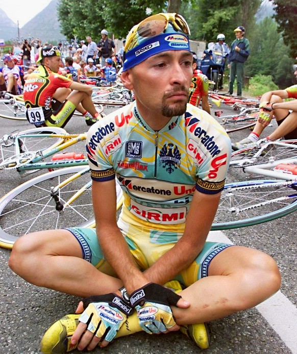 Italian Marco Pantani is seated on the road on July 24, 1998, during the Tour de France cyclists&#039; demonstration at the beginning of the 12th stage of the French cycling race in Tarascon-sur-Arieg ...
