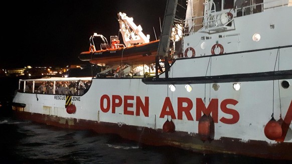 epa07783101 The Spanish humanitarian ship &#039;Open Arms&#039;, with migrants on board, arrives in Lampedusa island, southern Italy, 20 August 2019. An Italian public prosecutor has ordered the confi ...