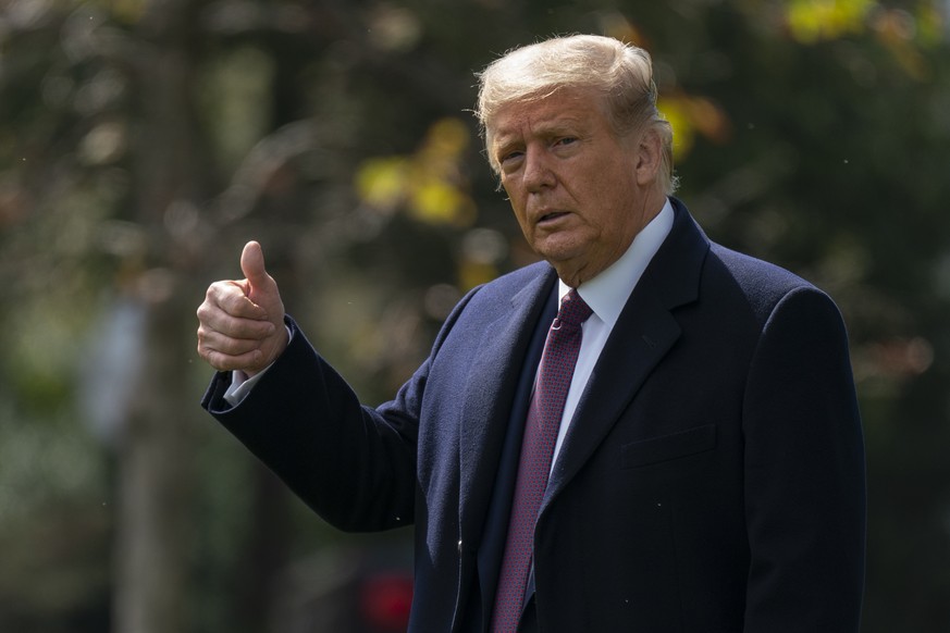 President Donald Trump give the thumbs-up as he walks to Marine One from the Oval Office of the White House in Washington, Thursday, Oct. 1, 2020, for the short trip to Andrews Air Force Base en route ...