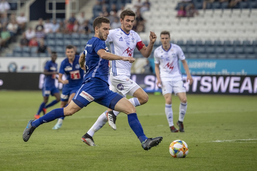 Otar Kakabadze, left, from FC Luzern and Jakup B. Andreasen, behind, from KI Klaksvik at the Europa League Qualification game, round 2 match between Switzerlands`s FC Luzern and Faroe Islands Team of  ...