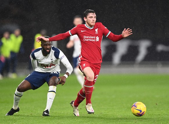 epa08972038 Liverpool&#039;s Andrew Robertson (R) in action against Tottenham&#039;s Tanguy Ndombele (L) during the English Premier League soccer match between Tottenham Hotspur and Liverpool FC in Lo ...