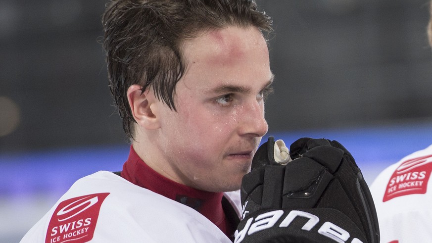 Switzerland&#039;s Denis Malgin, looks disappointed after the ice hockey U18 World Championships bronce medal game match between Switzerland and Canada, at the ice stadium Bossard Arena in Zug, Switze ...