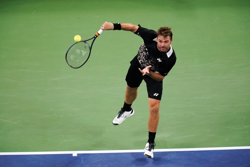 epa06988756 Stan Wawrinka of Switzerland serves to Milos Raonic of Canada during the fifth day of the US Open Tennis Championships at the USTA National Tennis Center in Flushing Meadows, New York, USA ...
