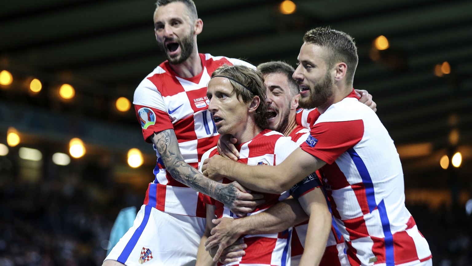Croatia&#039;s Luka Modric is celebrated after scoring his side&#039;s second goal during the Euro 2020 soccer championship group D match between Croatia and Scotland at the Hampden Park Stadium in Gl ...