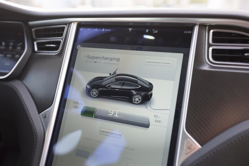 The charing progress on the car computer of a a Tesla model S 85D that is being charged at a high-powered supercharger station in Dietlikon, Switzerland, on August 17, 2016. Tesla manufactures equipme ...