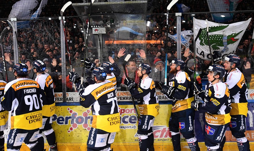 Ambri&#039;s players celebrate the 4-2 victory, during the preliminary round game of National League Swiss Championship between HC Ambri Piotta and SCL Tigers, at the ice stadium Valascia in Ambri, on ...