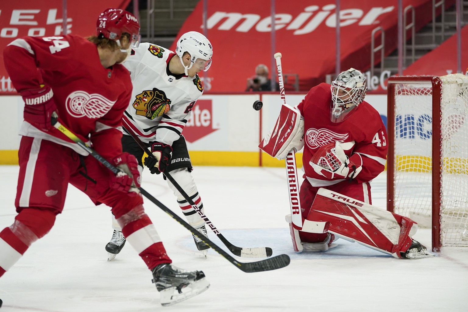 Detroit Red Wings goaltender Jonathan Bernier (45) stops a shot by Chicago Blackhawks center Pius Suter (24) in the third period of an NHL hockey game Wednesday, Feb. 17, 2021, in Detroit. (AP Photo/P ...