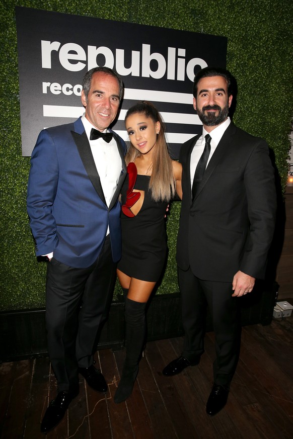 LOS ANGELES, CA - FEBRUARY 15: (L-R) CEO of Republic Records Monte Lipman, Recording artist Ariana Grande, and Ayman Hariri attend the Republic Records Grammy Celebration presented by Chromecast Audio ...