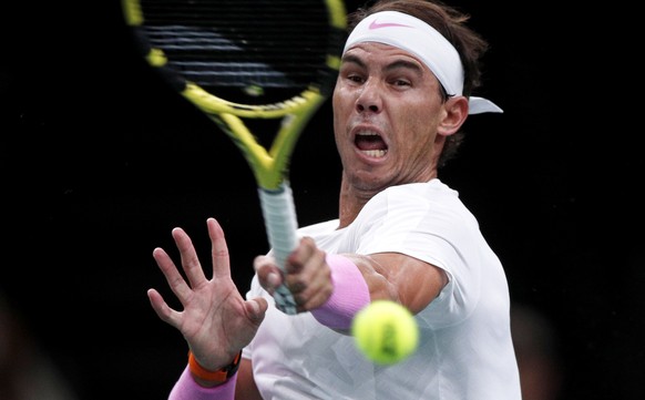 epa07960749 Rafael Nadal of Spain in action against Adrian Mannarino of France during their second round match at the Rolex Paris Masters tennis tournament in Paris, France, 30 October 2019. EPA/YOAN  ...