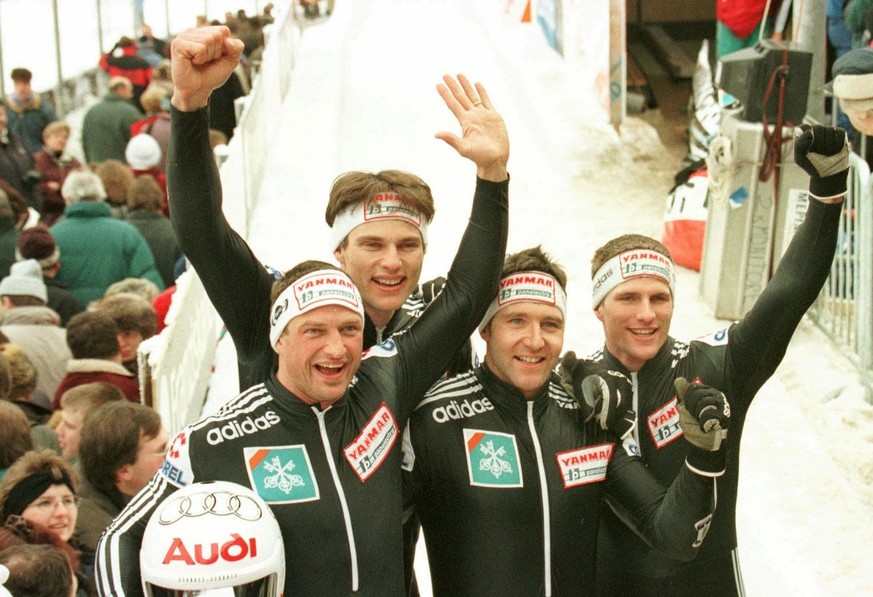 Reto Goetschi, Guido Acklin, Daniel Giger und Beat Seitz (from the left) of Switzerland jubilate after winning the four-men race at the European Bobsled Championships at Koenigssee Sunday, January 19, ...