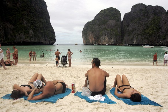 epa07560130 (FILE) - Tourists bask in sunlight on Ko Phi Phi Le Island, Krabi Province, Thailand, 07 December 2005 (reissued 10 May 2019). According to Thailand&#039;s National Parks Department (NPD)  ...