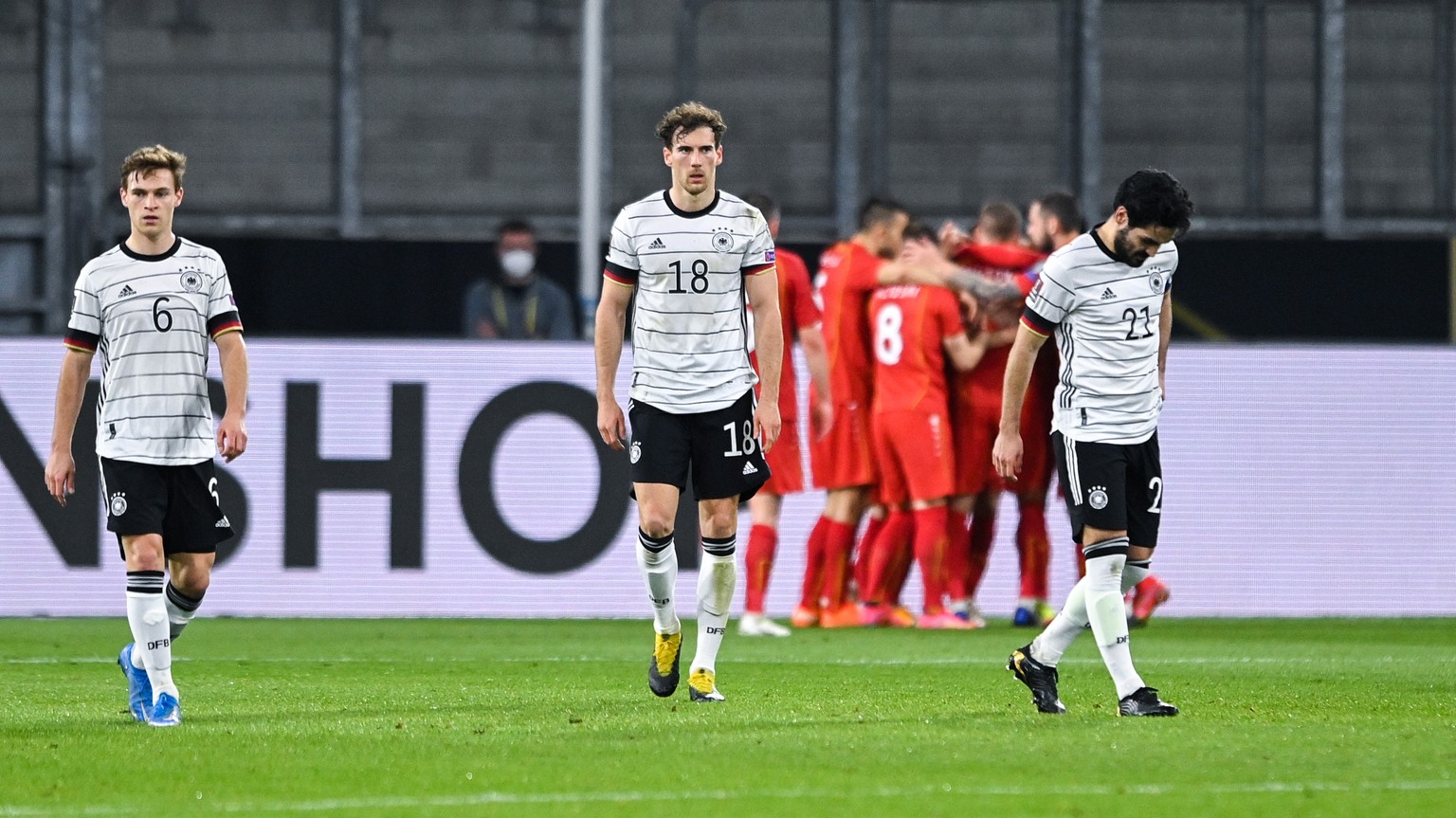 epa09109274 Germany?s players (front) after North Macedonia scores the 0-1 during the FIFA World Cup 2022 qualifying soccer match between Germany and North Macedonia in Duisburg, Germany, 31 March 202 ...