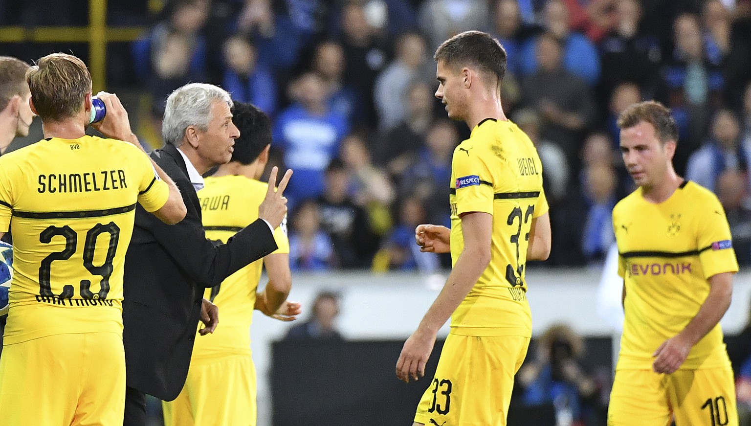 Dortmund coach Lucien Favre, left, gestures to his players during the Champions League group A soccer match between Club Brugge and Borussia Dortmund at the Jan Breydel Stadium in Bruges, Belgium, Tue ...